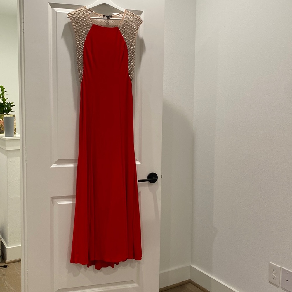 Red floor length dress, mesh beaded shoulders, beaded back.